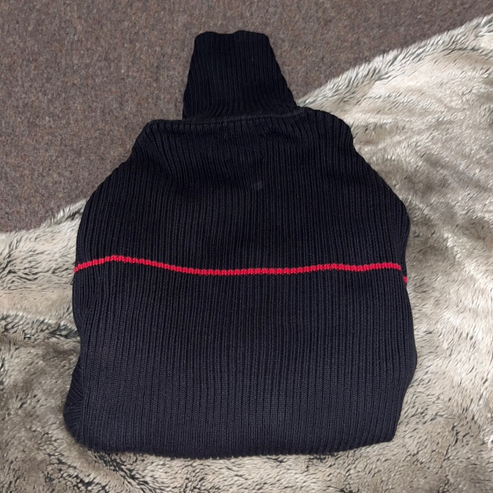 Black Turtleneck with Thin Red Stripe